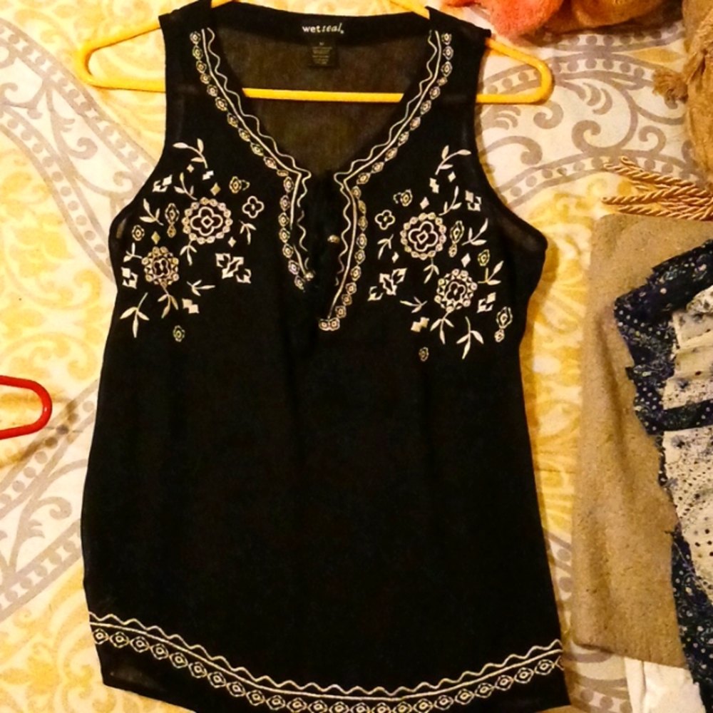 A sheer black embroidered top